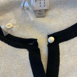 Brand new cardigan with tags metallic white with black trim, pearl buttons.